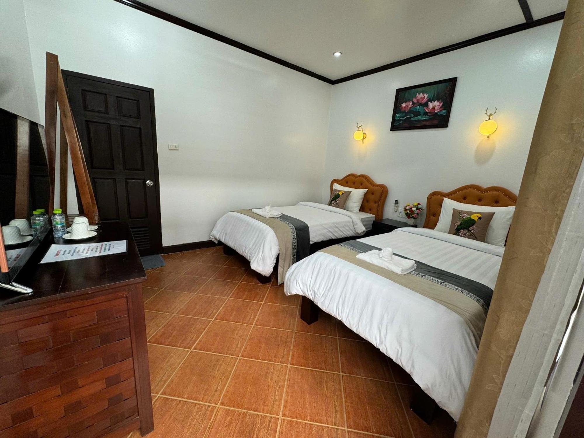 Win Hotel Vang Vieng Quarto foto
